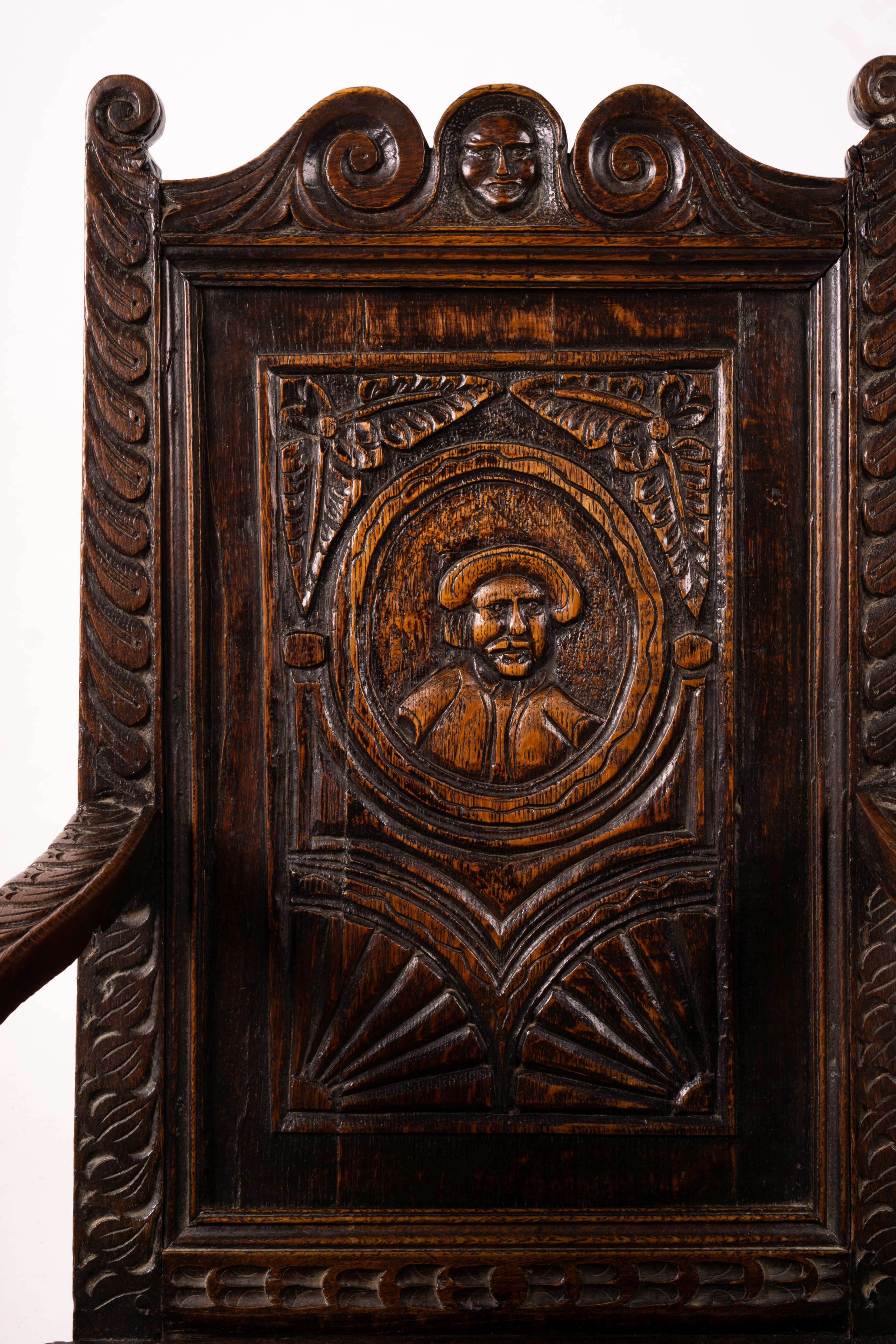 An 18th century style carved oak wainscot chair, width 56cm, depth 60cm, height 101cm